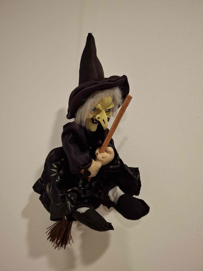 Kitchen witch on broomstick