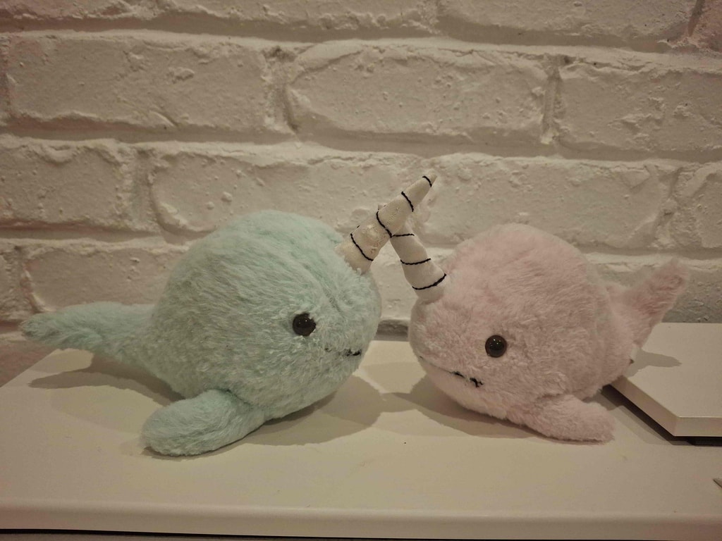 Pastel narwhal plush pair — repair